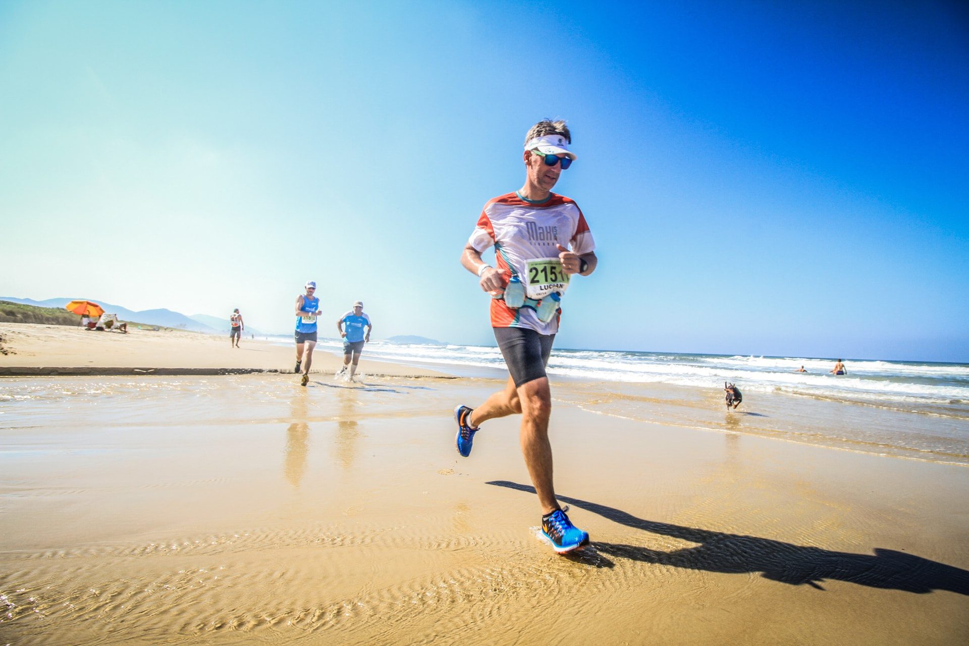 Triathlete running along the beach